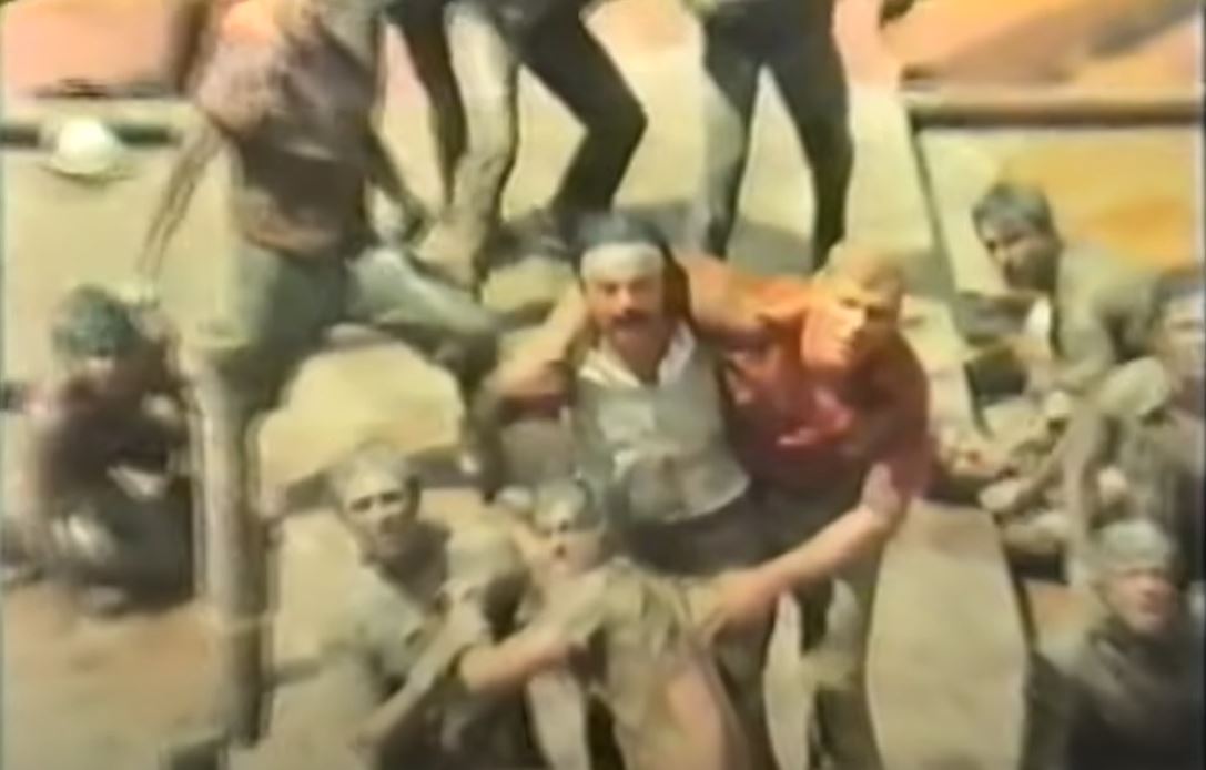 Julio and his crew staring at a supervisor after a fight