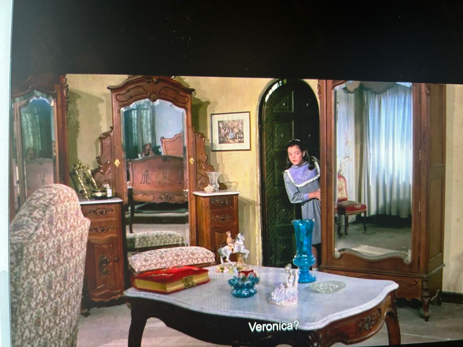 Flavia is dressed in pastel purple that matches with the set.