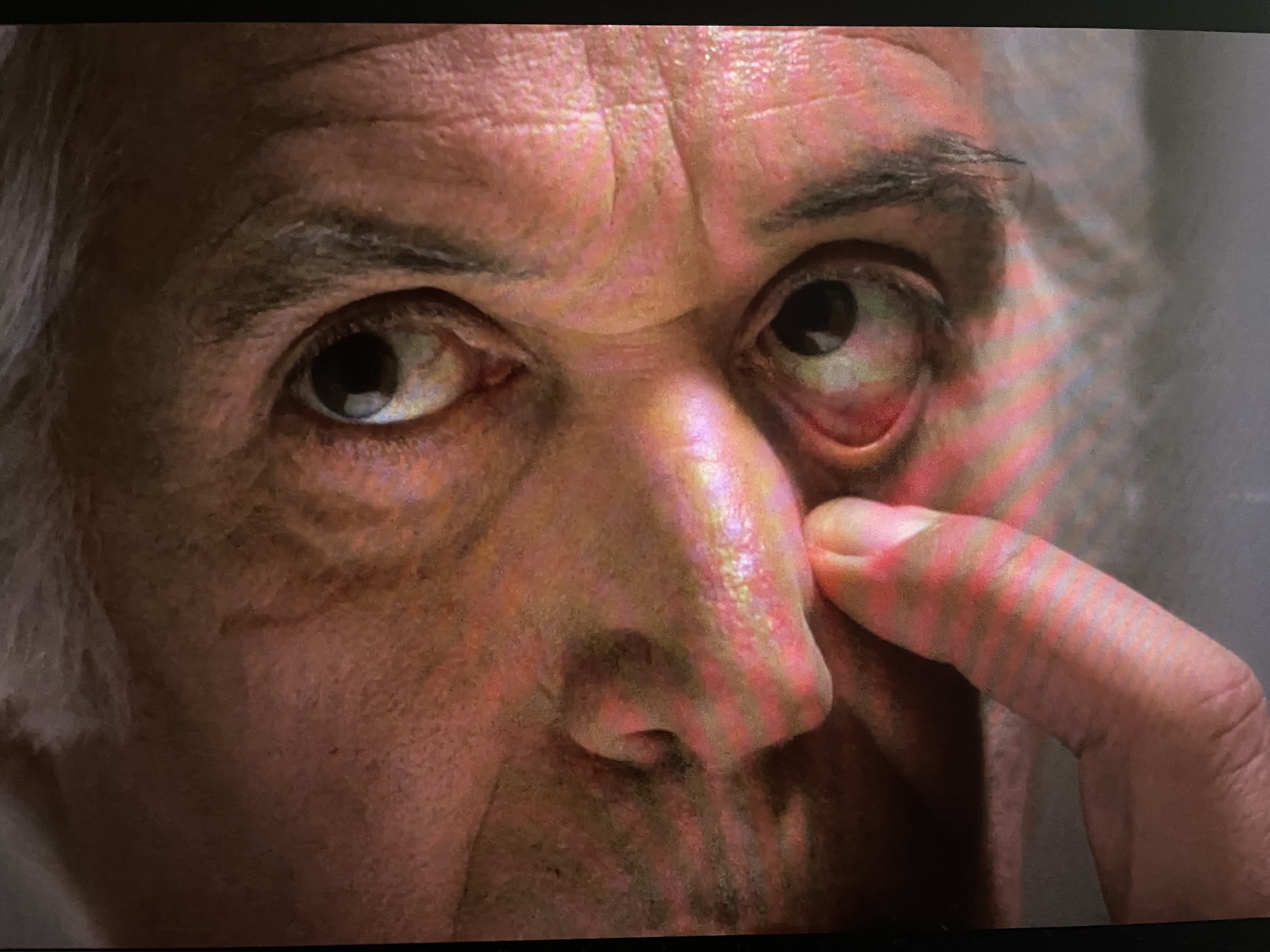 Shot of Jesus tugging on his eye