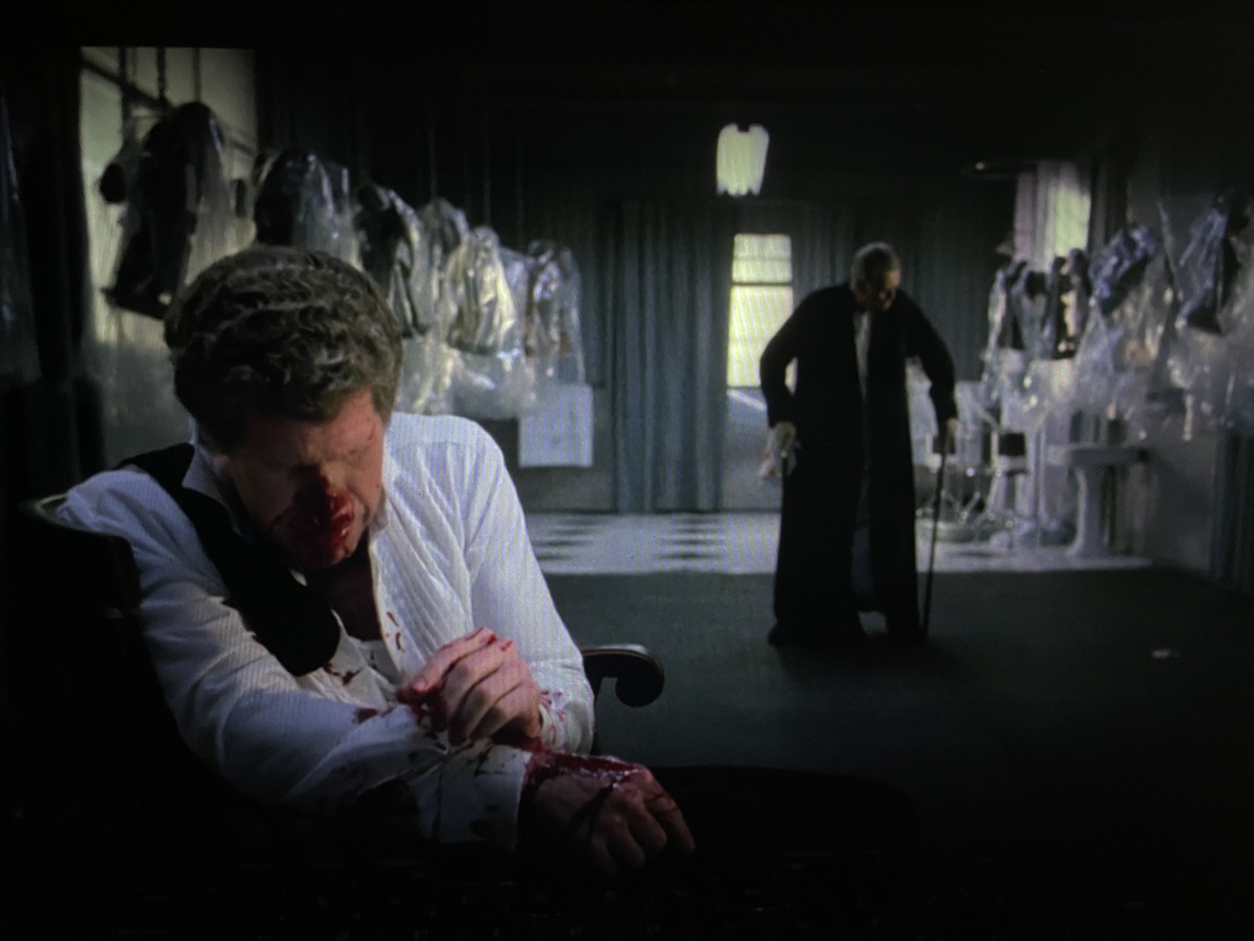 The business man strikes his grandson, Angel, after he fails to bring him the device