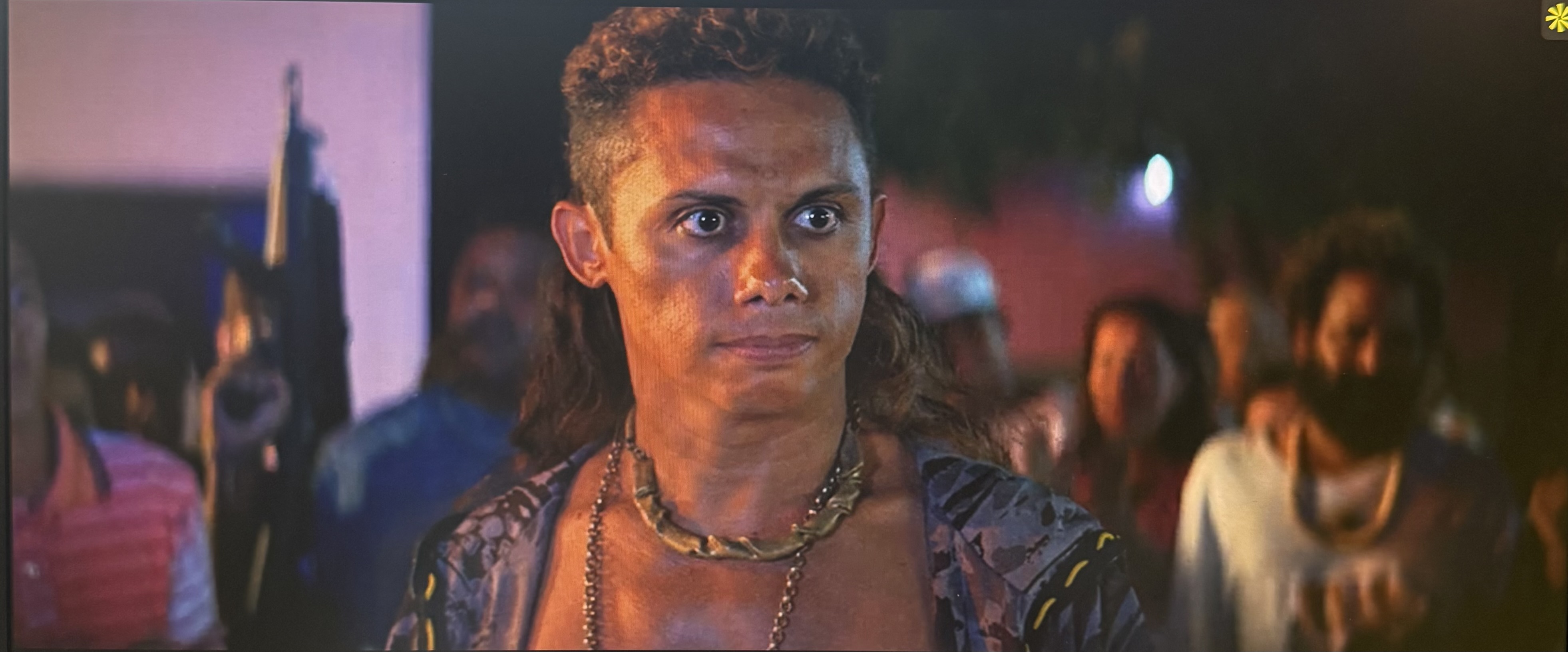 This costume shows the dangerous Lunga with necklaces and open shirt and his hair down.