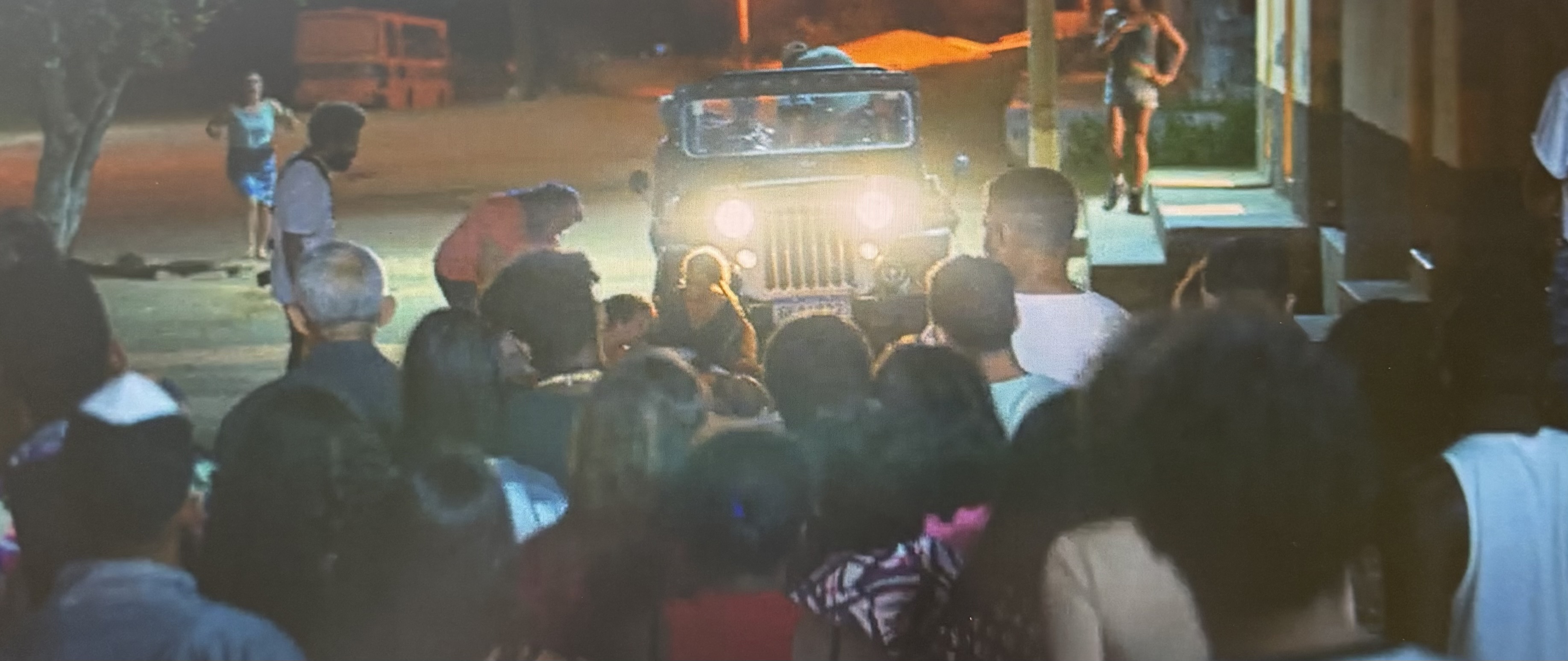 Shows the village gathered together when someone was screaming in pain. 