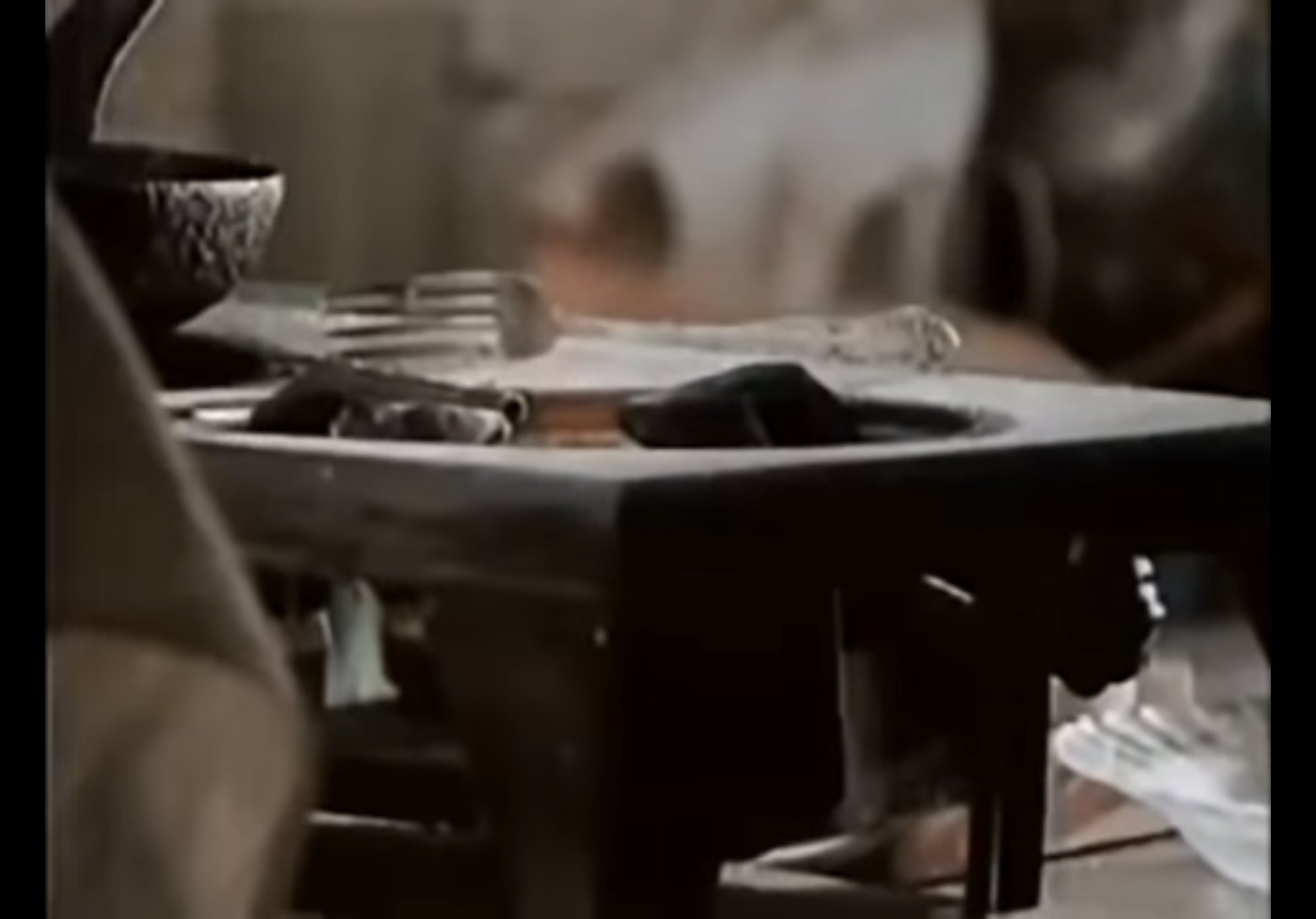 Close-up of stove turned off and fork.