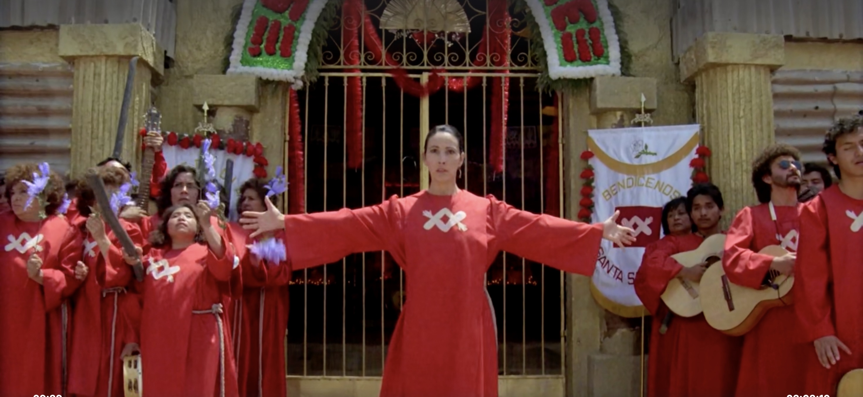 oncha, the armless mother, dresses in flowing frocks, which make her a ghostly emblem of control, especially in red. Her brazen dress contradicts her physical lack, creating an incongruous image of power through negation.