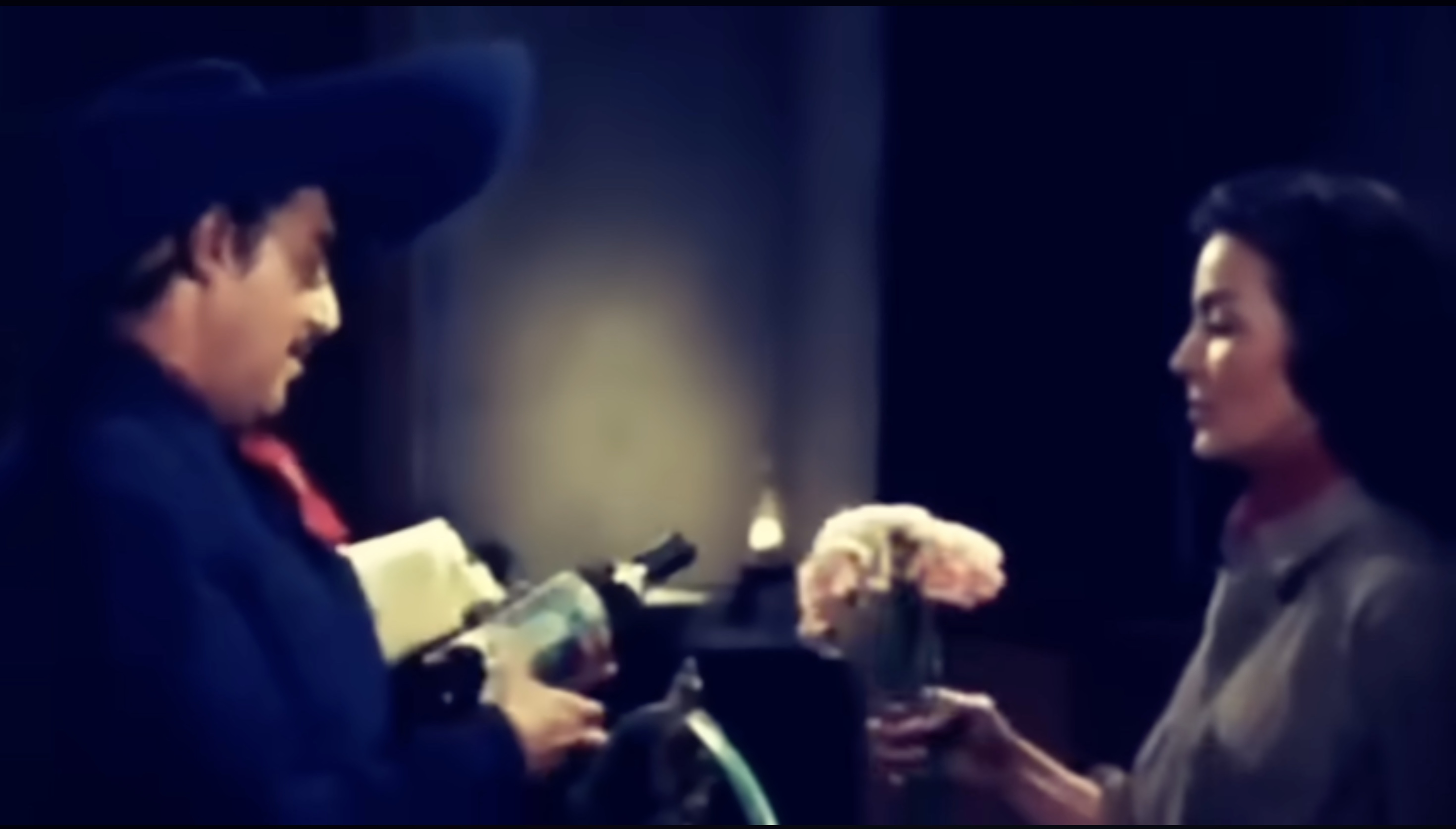 Colonel Zeta and Isabel exchanging a flower.