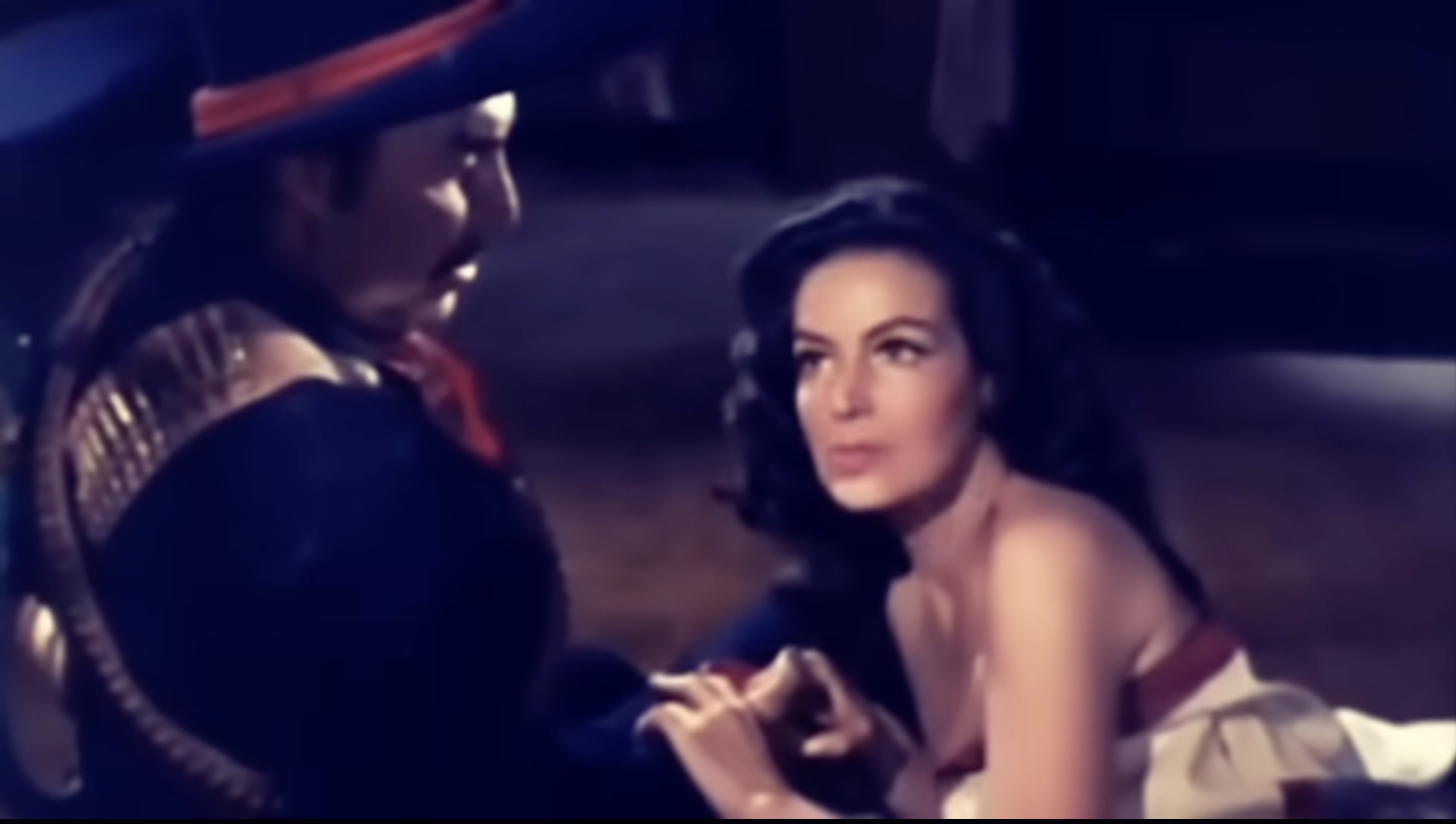 Still from La Cucaracha (1959) showing Isabel with loose, full hair and soft makeup in a close, intimate framing.