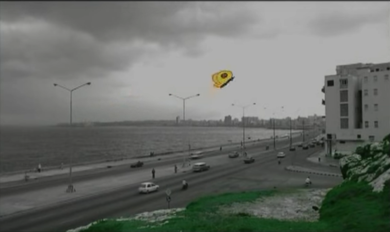 Final scene overlooking the Cuban beach with the yellow butterfly and the green grass