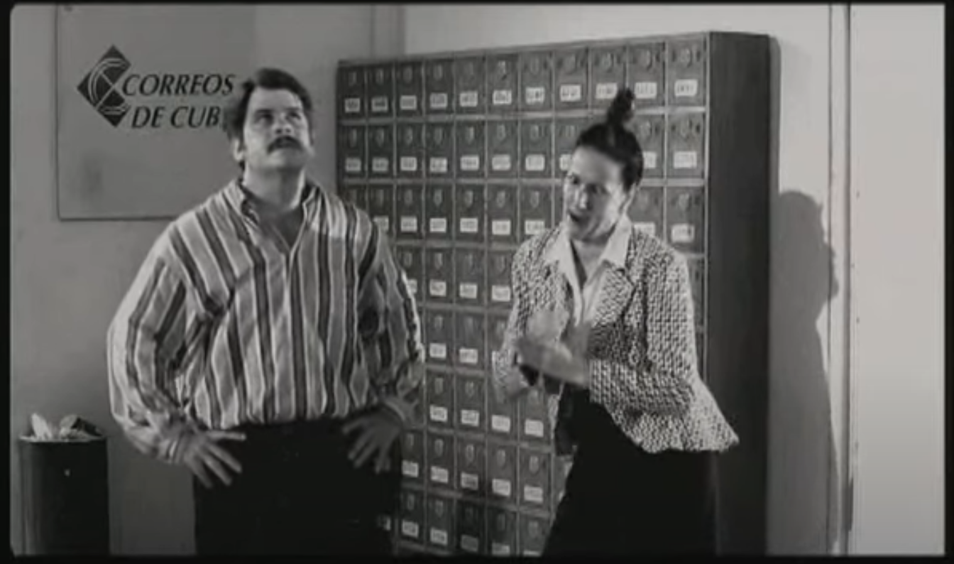 Concha and Professor Calzado arguing in the post office