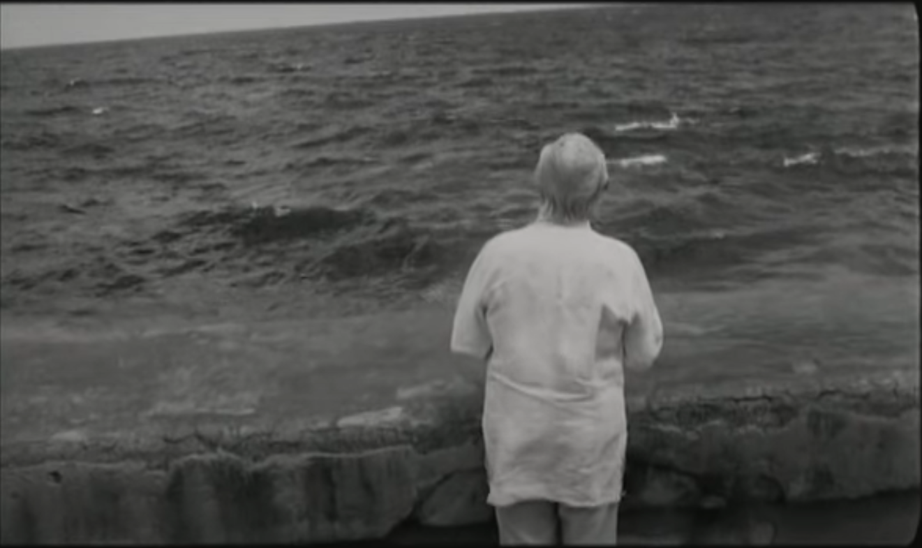 Old man stares at the ocean