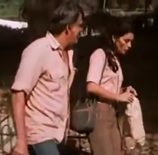 Oscar wears a coral-pink shirt; matching Lina's.