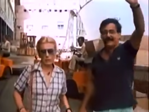 Marián wears a striped white and black shirt while Oscar wears a dark polo.