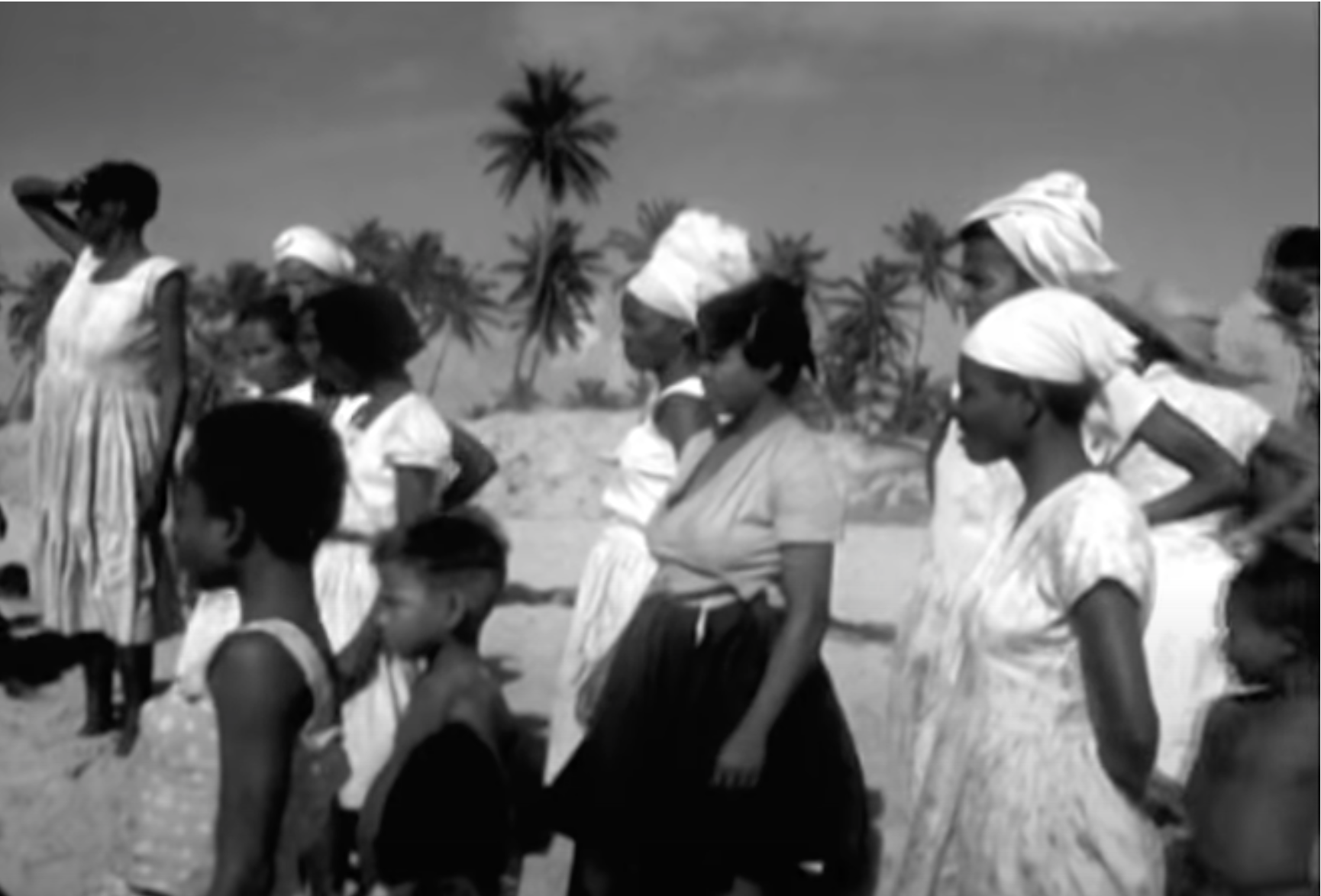 People of Buraquinho watching the fishermen sail to deeper waters.