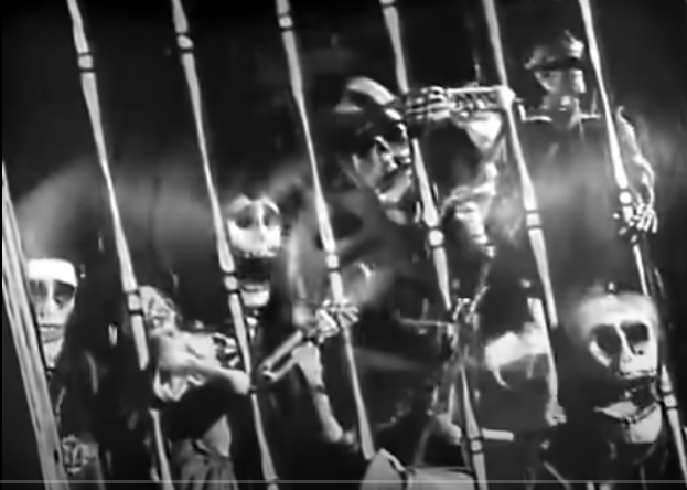 Macario's sleeping face is in the background, with images of dancing skeletons superimposed on top.