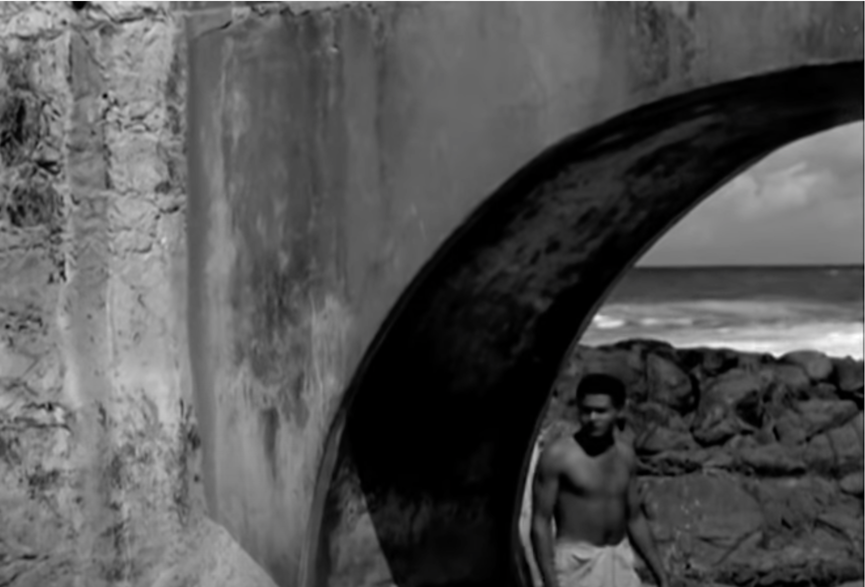 Aruã after he has been shunned from the village under a bridge.