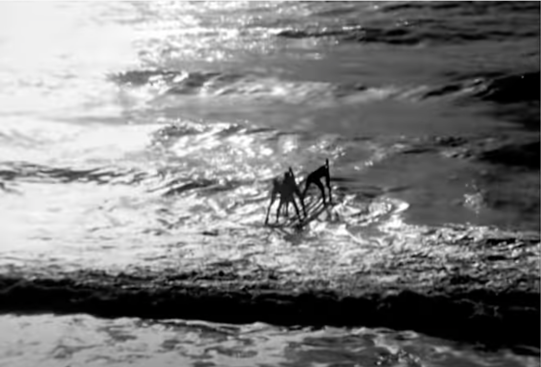 Men paddling to deeper waters.