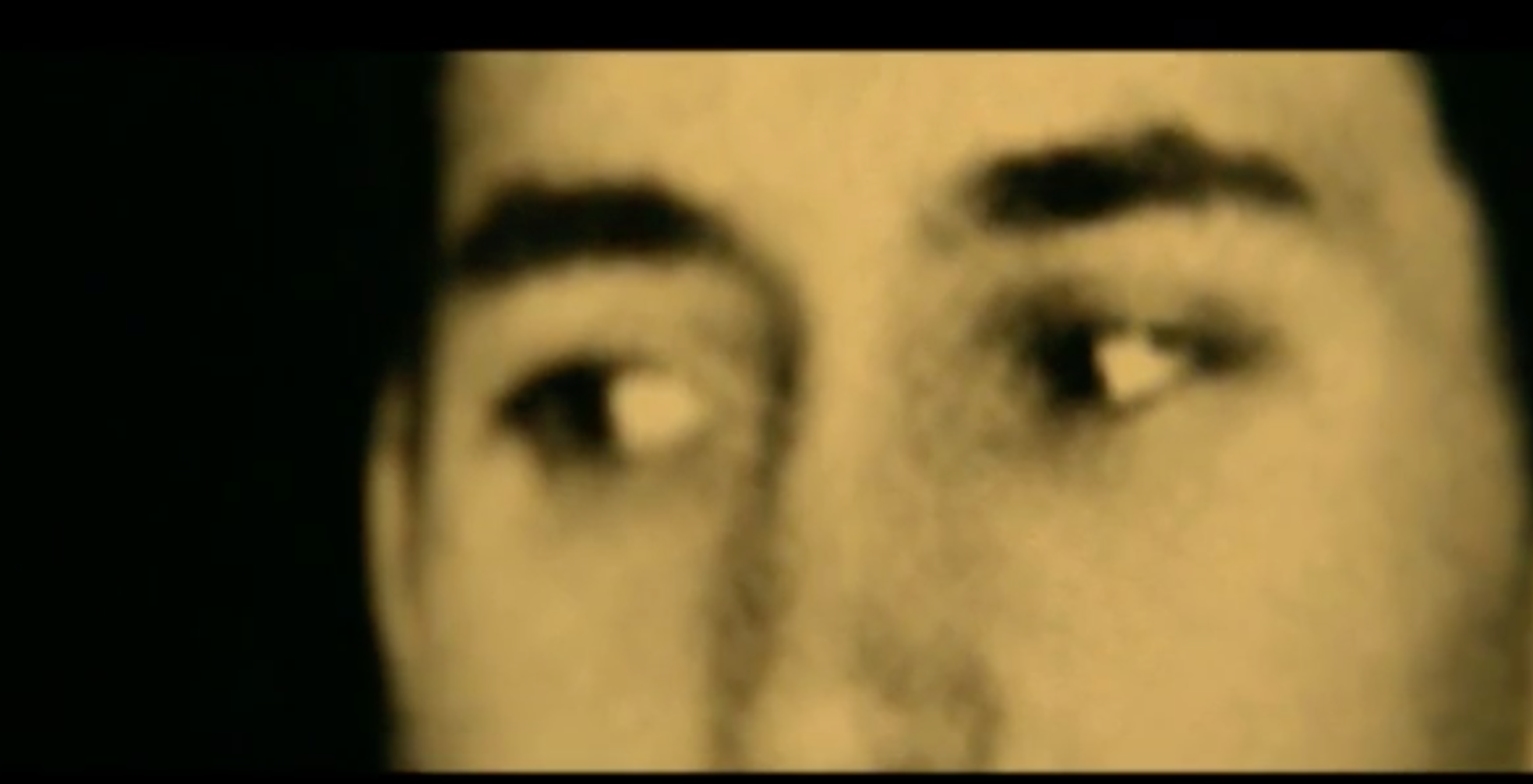This shot is a close-up of Isidoro's eyes as he gazes longingly at Lilana from afar.