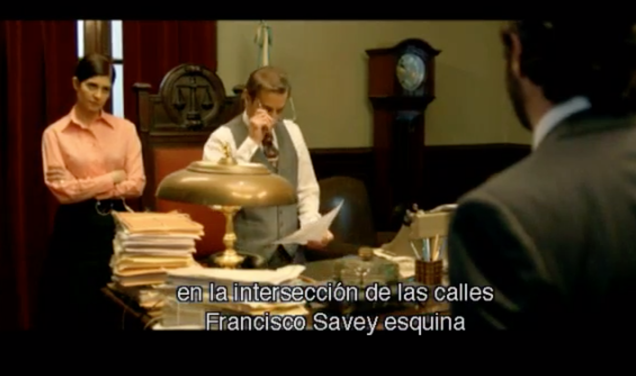 We see the different judiciary agents working in formal business attire.