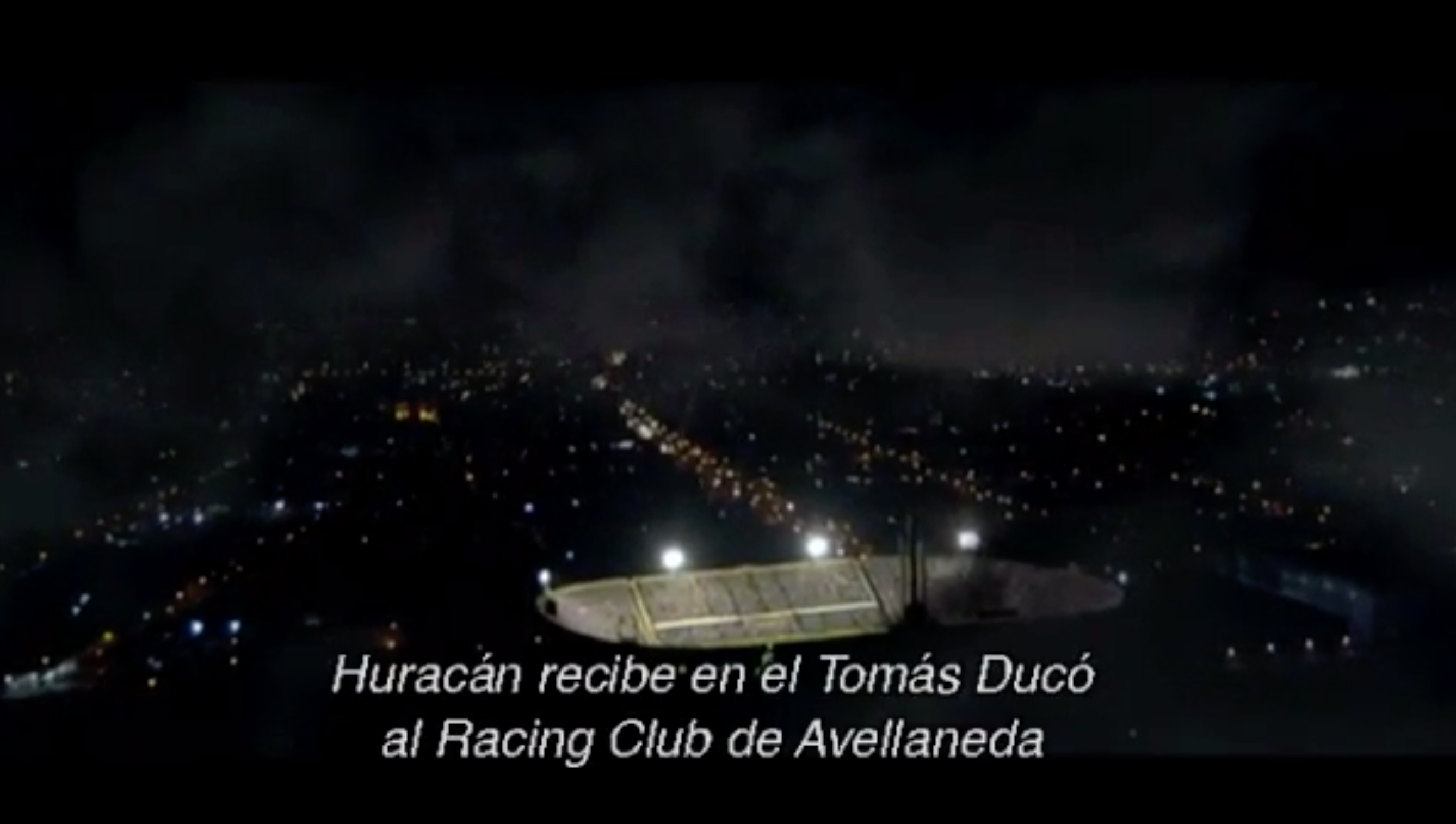 We see the Tomás Adolfo Ducó Stadium from an aerial view, setting the stage for the scene to come.