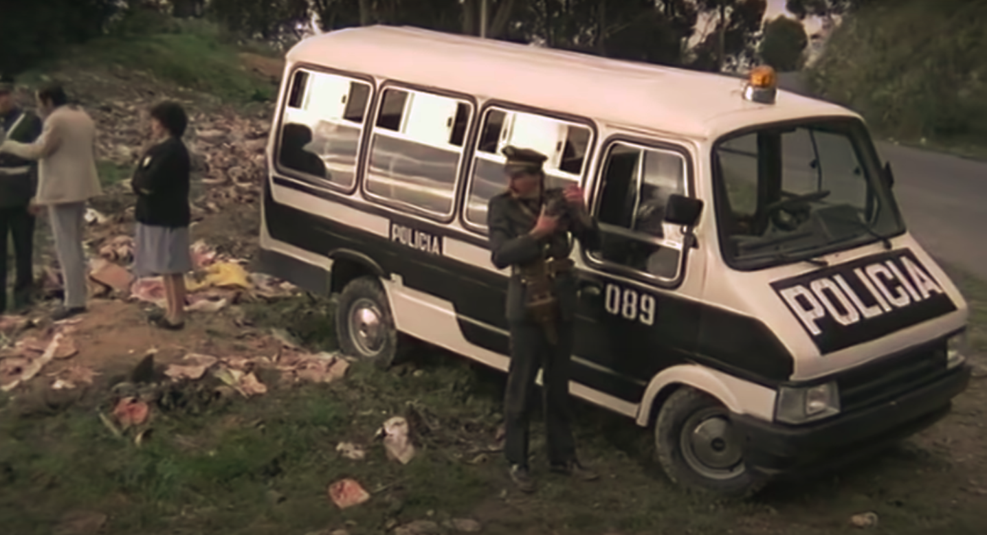 A police officer is seen running from an ambulance (before pan)