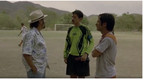 In this image, the scouter is talking to Beto and Tato in what in the movie is a "soccer field", but in reality its just a dirt field with no grass. 