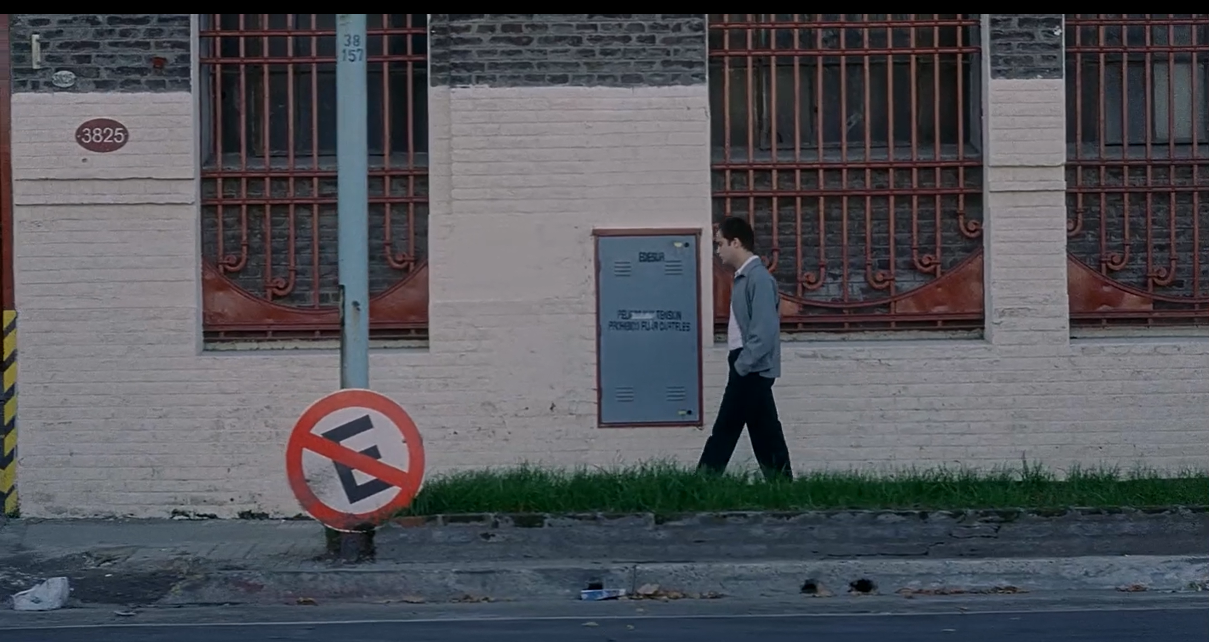 Juan walking to a warehouse at the end of the film.