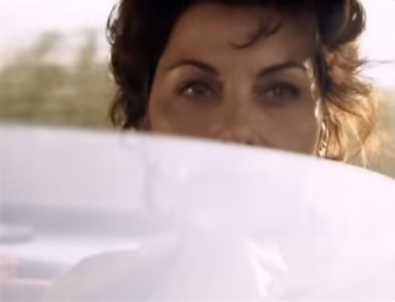 Georgina stares out car window