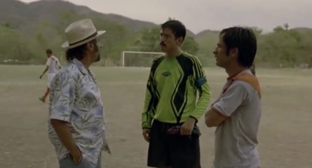 The camera frames the brothers together in the same shot, visually reinforcing their closeness and shared path before fame begins to separate them.