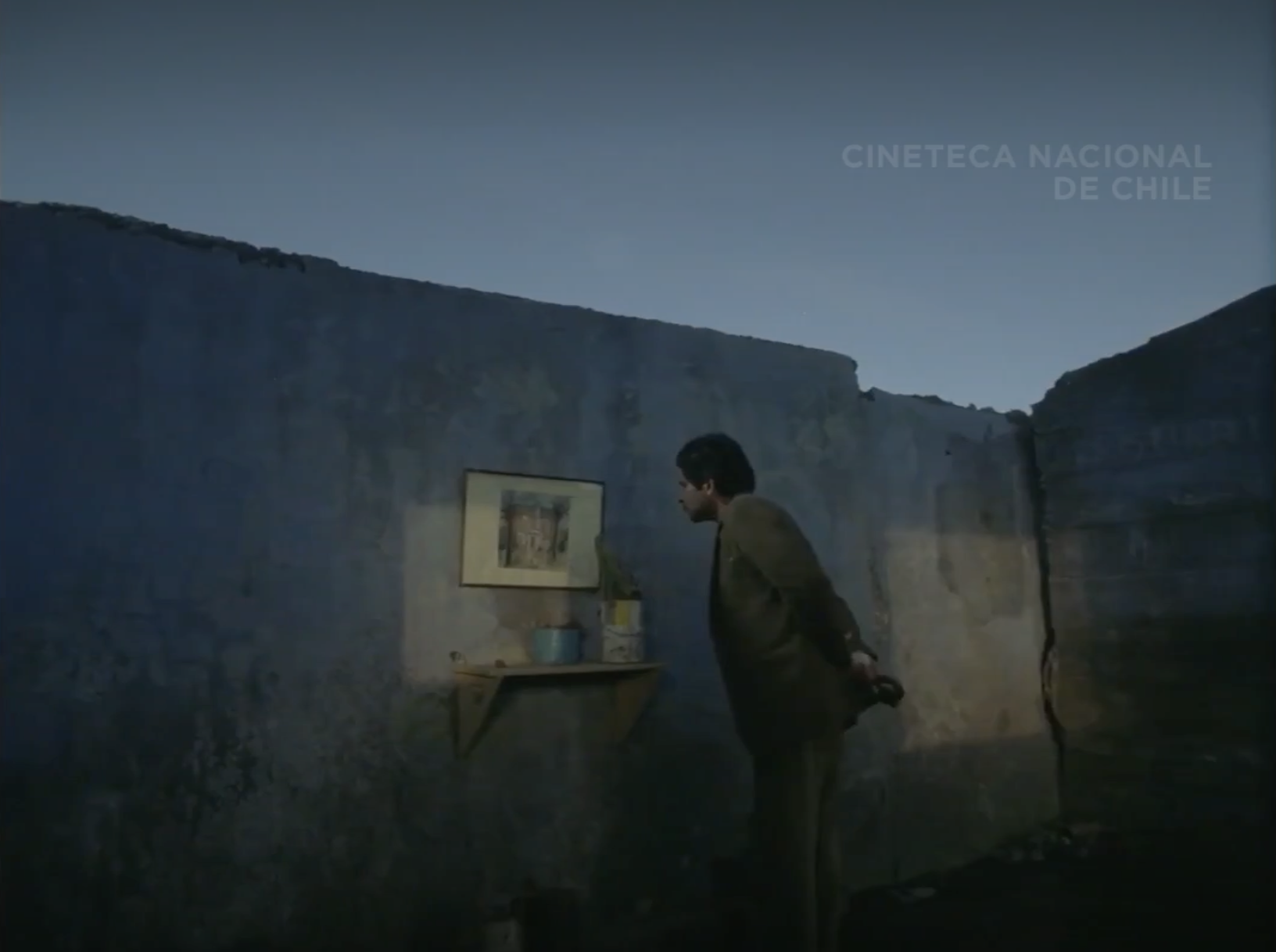 Ramiro entering ruined house.