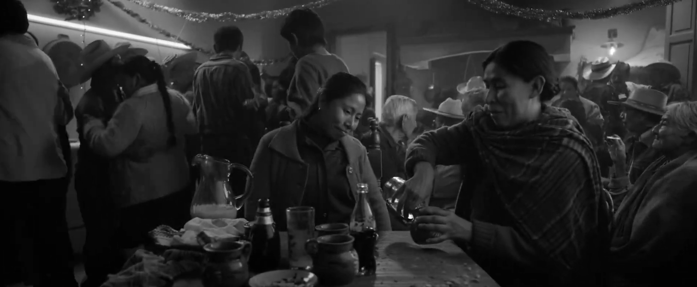 Cleo in a packed environment wearing dark clothing.