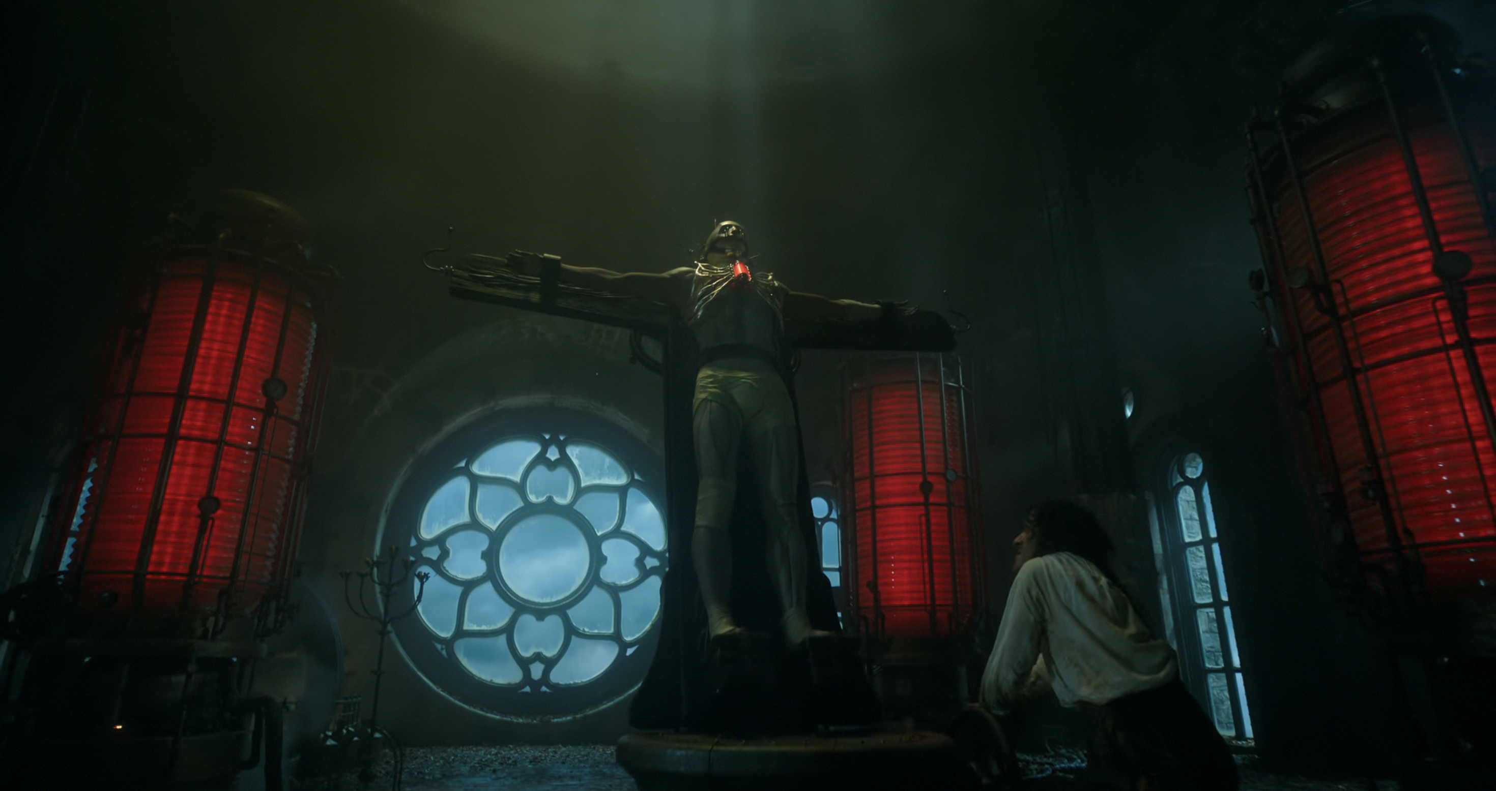 Victor kneels before the creature unsure if its alive.