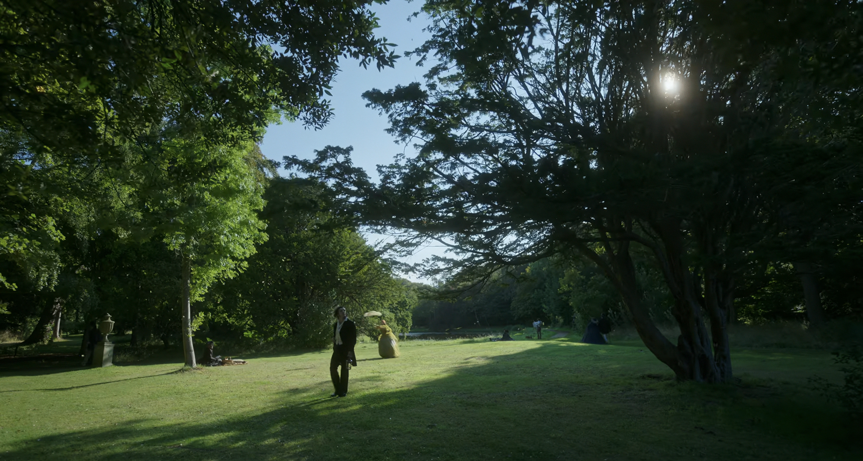Elizabeth and Victor in surrounded by foliage. 