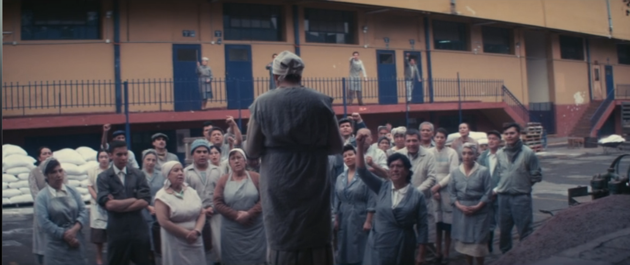 Said manifesto being read out to a group of peasants outside