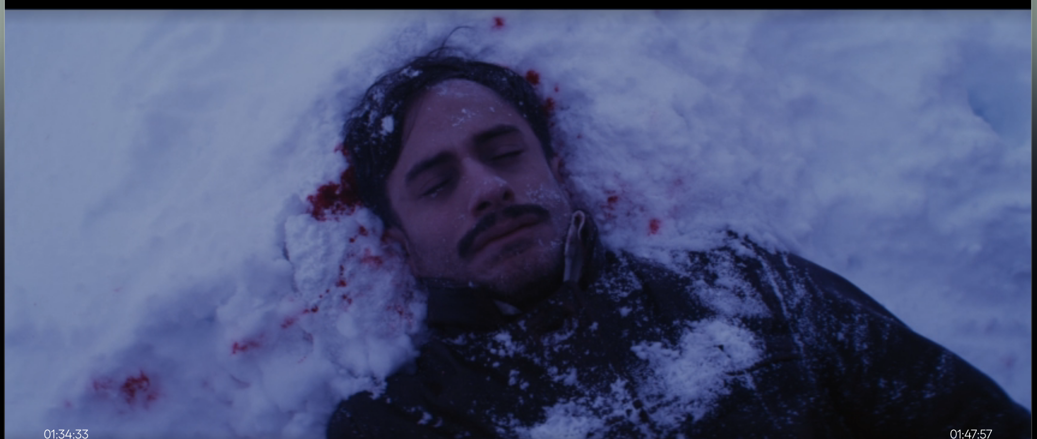 Peluchonneau's face against the snow, splattered in blood.
