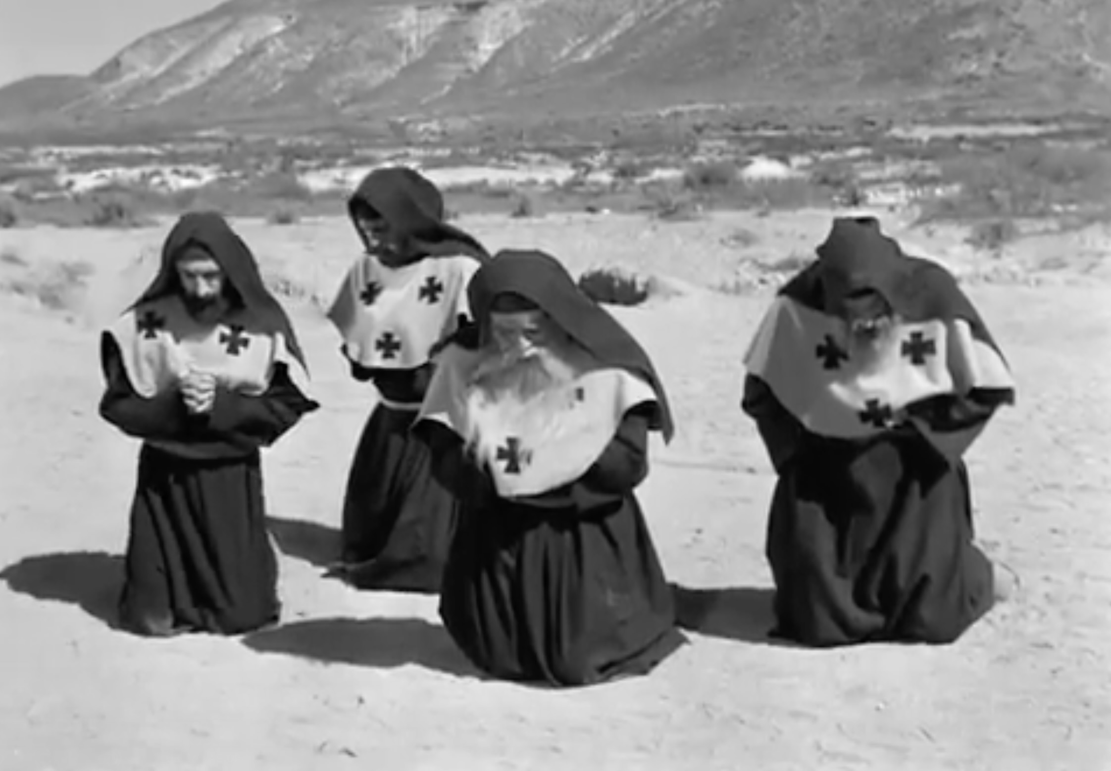 Group of church members with clerical garments (with crosses) worshipping with Simón.