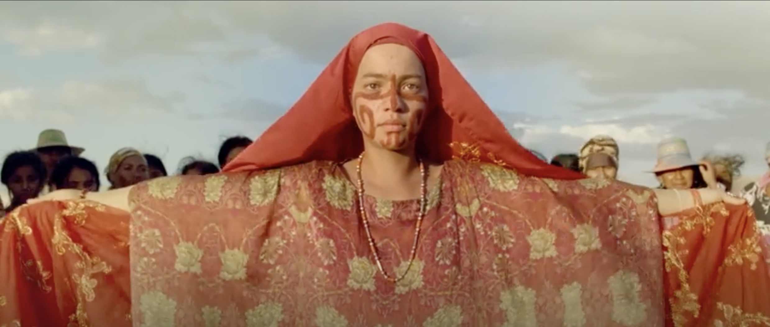  Zaida wears ceremonial clothing and facial paint.