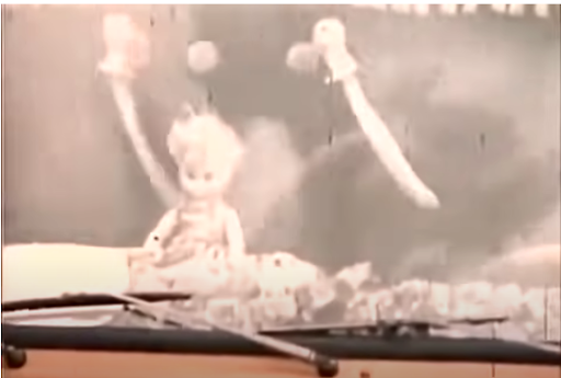 There is a doll on the truck's dashboard. 