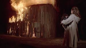 Flavia watching the barn burning. 