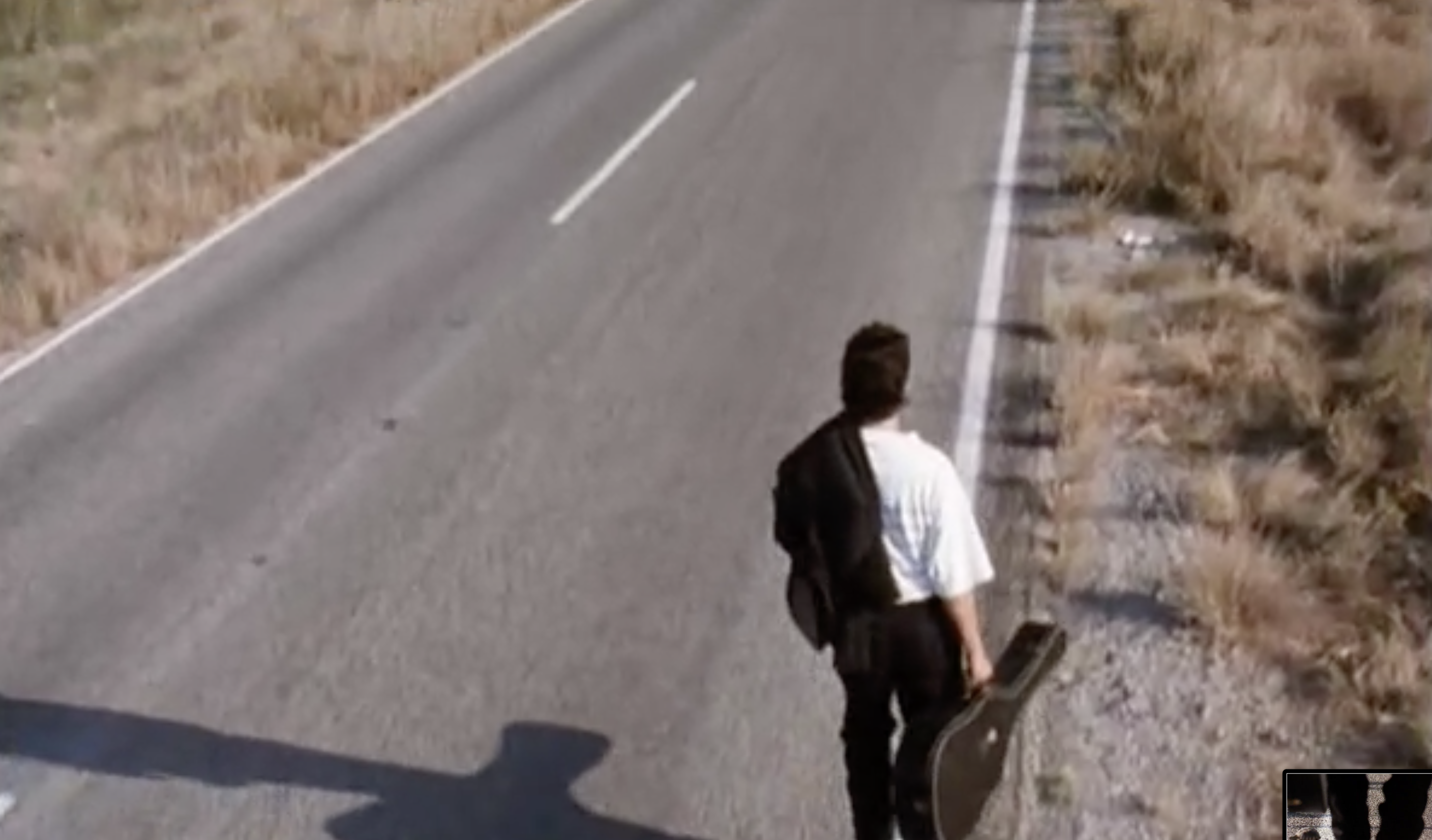 high angle shot of mariachi walking on the road