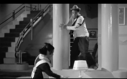 Cantinflas has on simple clothes.