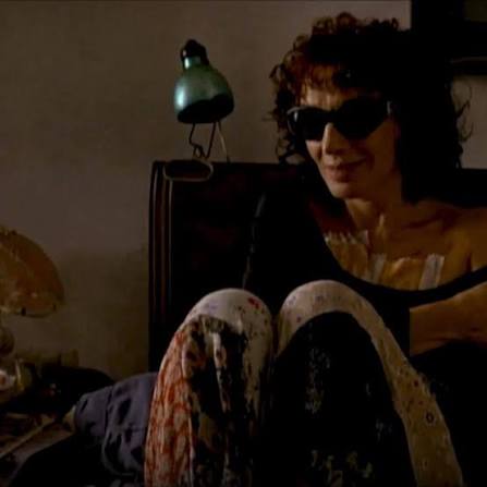 This is Mecha in bed in her silky patterned pants and her loose black sweater.