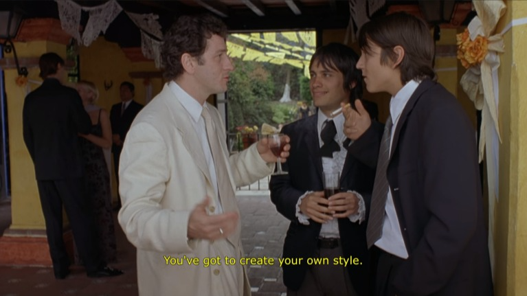 Tenoch, Julio, and Jano converse at a wedding.