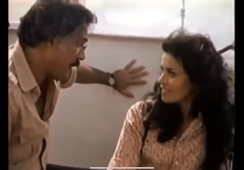 Lina and Oscar staring at each other in conversation when they first meet