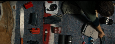 A dead man's belongings being picked over.